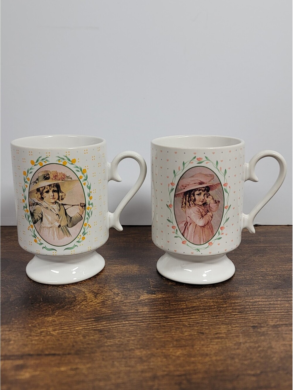 Set Of 2 Vintage 1990 Maud Humphrey Bogart Handle Pedestal Coffee Mug